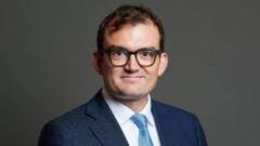 Tory MP charged with two sexual assaults at London’s Groucho Club