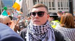 Kneecap rapper bailed over terror charge as protesters gather outside court