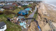 Fourteen clifftop homes face ‘imminent’ collapse